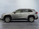 the toyota rav is parked in a large room with a gray floor