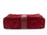 the red sued toilet bag with brown leather straps