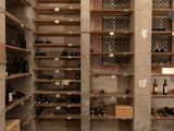 many bottles of wine on the shelves in this wine cellar