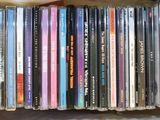 a lot of cds stacked on top of each other