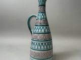a blue and white vase with a pattern on it