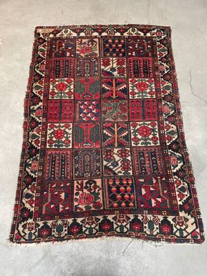 an old persian rug on a floor