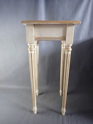 an image of a small table with a wooden top