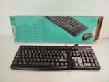 a black keyboard and mouse in a box on a table