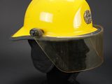 a close up of a yellow hard hat on a mannequin head