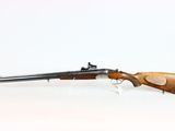 a rifle on a white background with a wooden handle