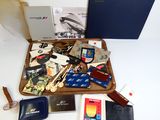 a wooden tray filled with assorted items on a white table