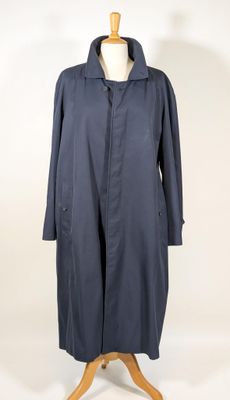 an image of a blue coat on a mannequin stand