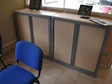 two blue chairs sitting in front of a counter