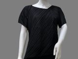 the mannequin is wearing a black top and black pants