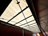 a view of a ceiling in a building with a skylight