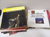 a lot of music books sitting on a table