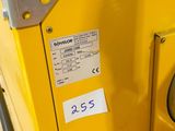 a close up of a yellow truck with a number on it