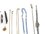 an assortment of jewelry including a watch, bracelets, and other items