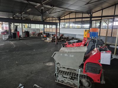 a large warehouse with a lot of machinery in it