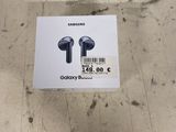 samsung earphones in a box on the floor