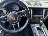 a steering wheel and dashboard of a car in a car showroom