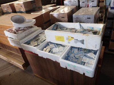 many boxes of assorted items sitting on a table