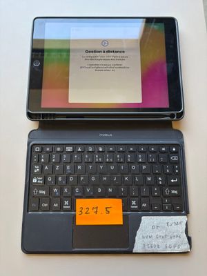 a laptop and a cell phone sitting on a table