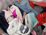 a pile of clothes that is sitting in a bag