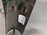 a close up of a metal object with a tag on it