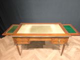 an image of a wooden desk with a glass top and two drawers