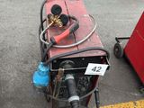 a lot of welding equipment on the ground in the parking lot