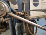 a close up of a machine with a hose attached to it