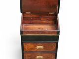 an old wooden chest with drawers and brass hardware on it
