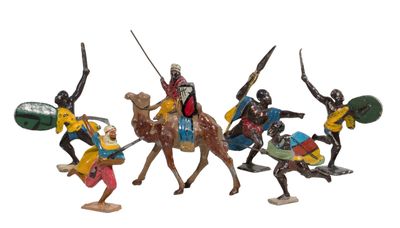 several figurines of people riding on horses with spears and shields