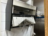 an image of a kitchen with a stove and a microwave