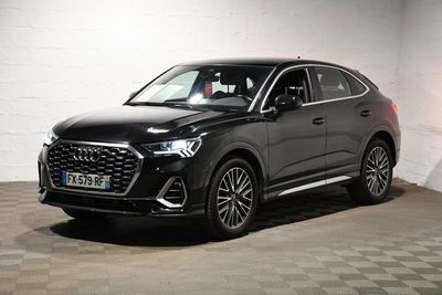a black 2020 hyundai kona is parked in a garage