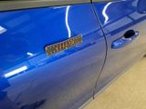 a close up of a car door with a sticker on it