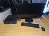 a desktop computer sitting on a desk with a keyboard and mouse