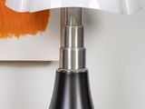 a lamp that is sitting on top of a wooden table