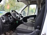 a white van with black seats and a steering wheel