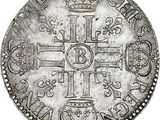 a silver coin with a cross and crown on it