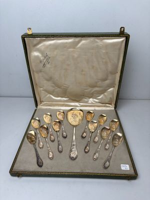 silverware in a case on a table with a white background