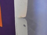 a close up of a piece of paper with a knife sticking out of it