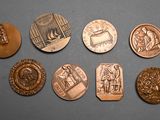 six different types of coins are shown on a gray surface