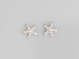 a pair of white gold and diamond earrings