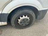 a close up of a flat tire on a van