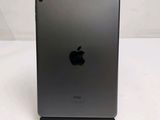 an apple ipad is sitting on top of a stand on a white surface