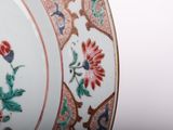 a close up of a plate with flowers on it