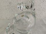 a glass figurine of a horse that is sitting on a table