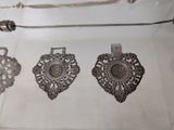 a display case with a variety of silver items
