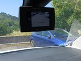 a view of a car from inside of a vehicle