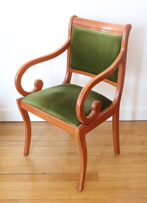 a wooden chair with green upholstered upholstered upholstered upholstered upholstered upholstered upholstered