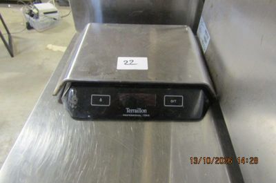 an image of a stainless steel counter top with a clock on it