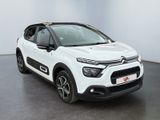a white citrole is parked in a white room